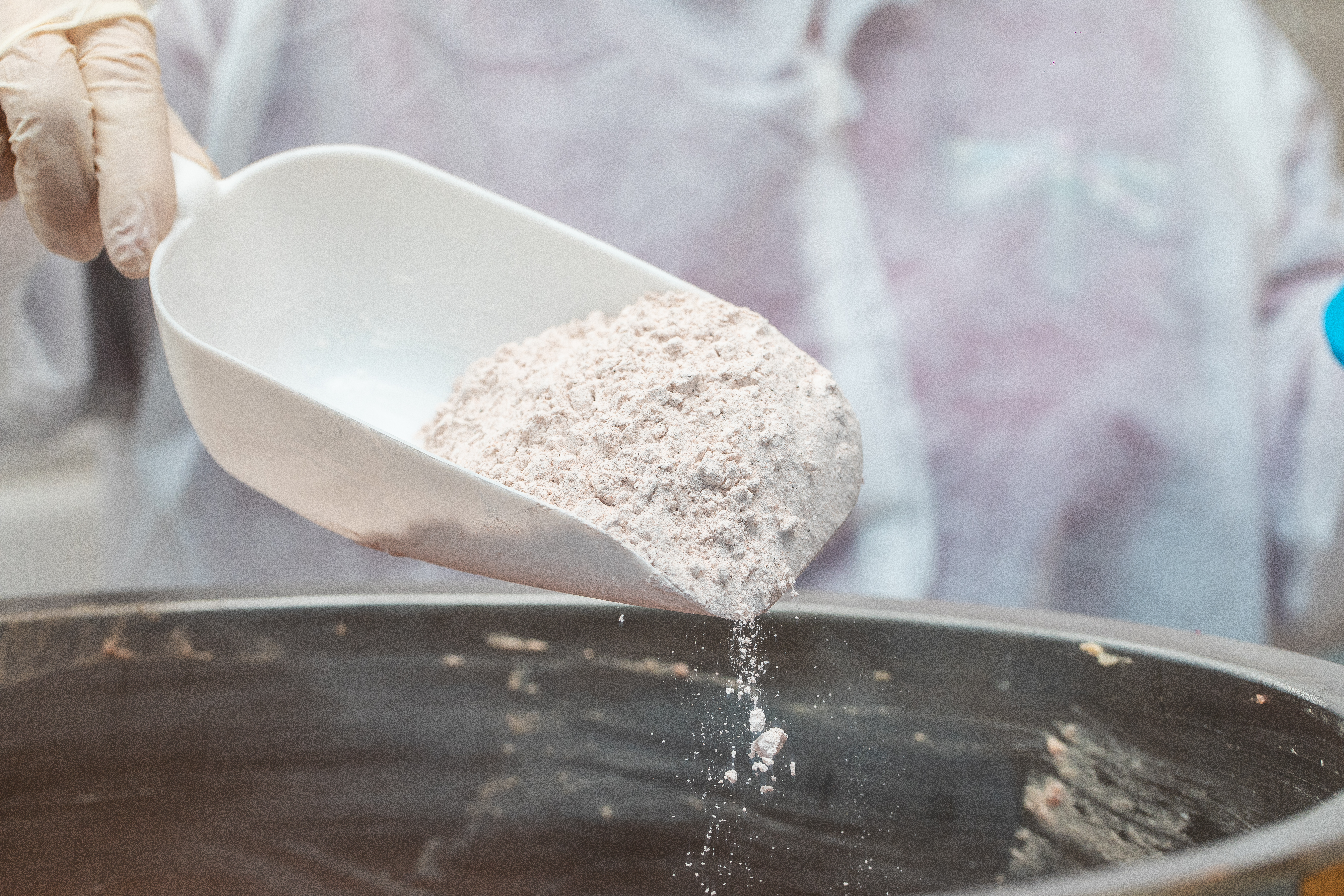 Adding all purpose flour into pan